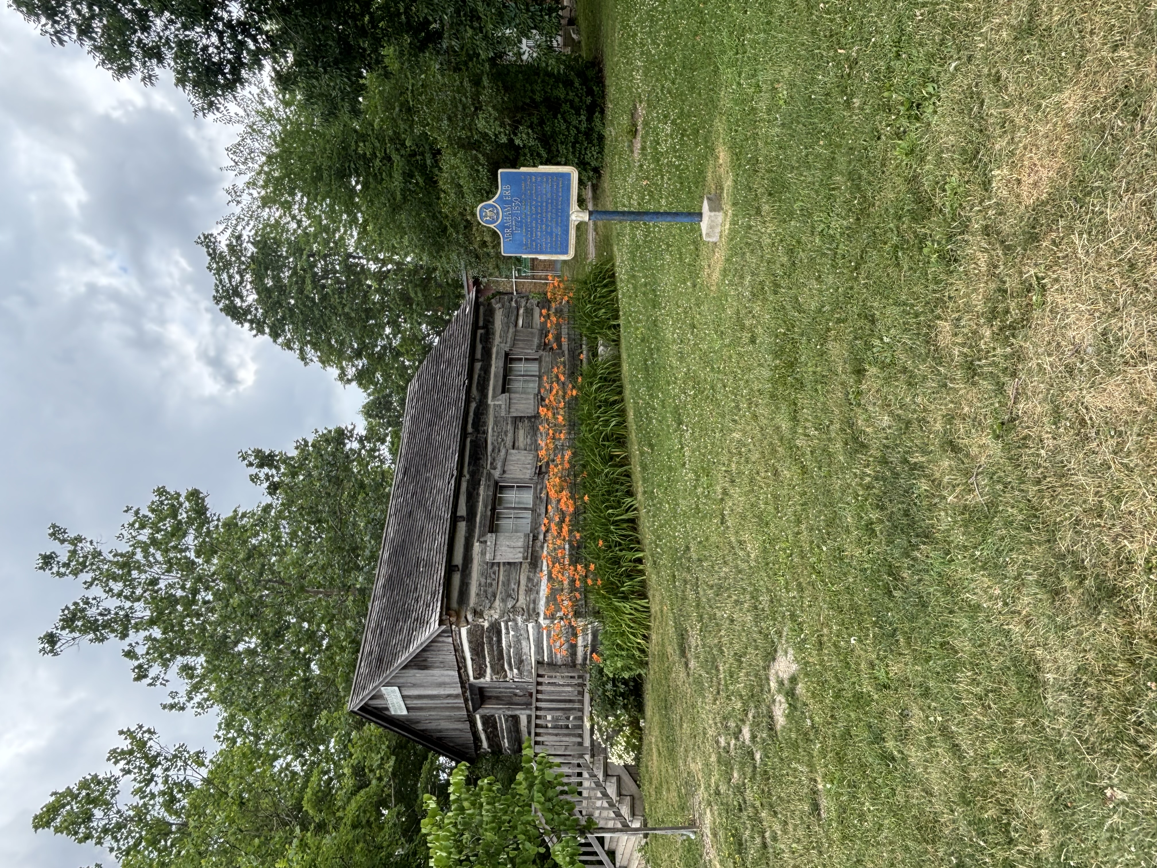 Historic log building and Abraham Erb plaque near Waterloo Park